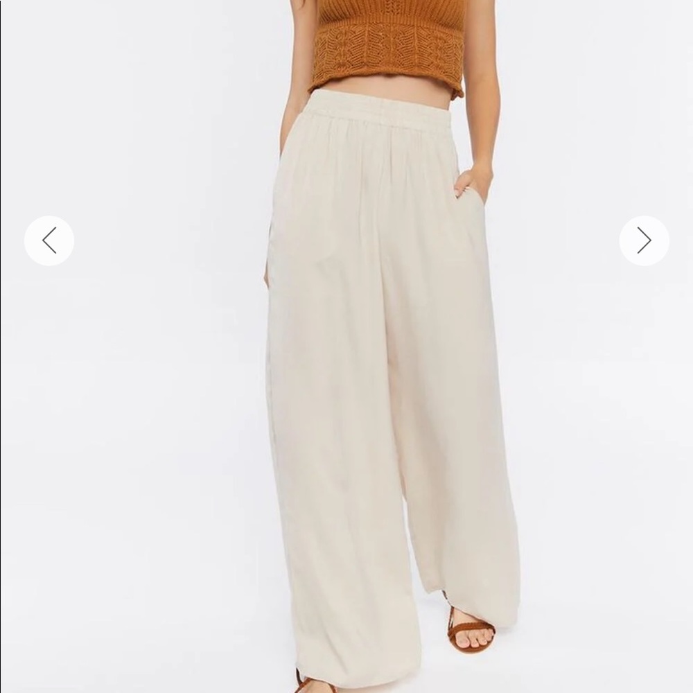 SAND WIDE LEG TROUSERS IN SIZE SMALL. WORN ONCE BOUGHT FROM BOUTIQUE